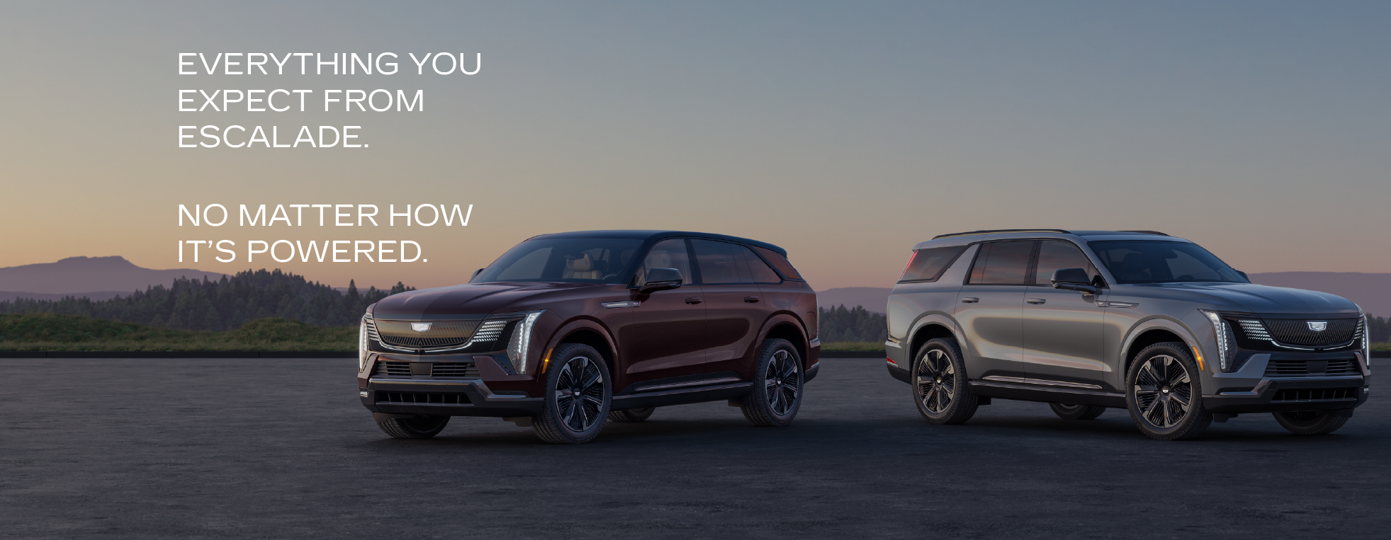 Two Cadillac Escalade SUVs parked at sunset, showcasing sleek design and versatility.